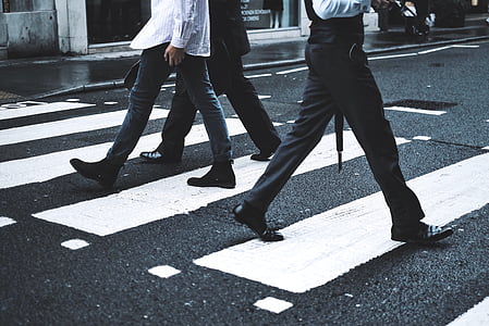 people walking on pedestrian lane during daytime thumbnail