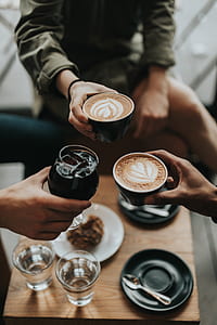 two person holding cafe latte thumbnail