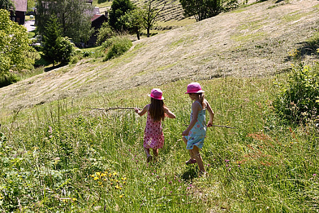 two girls walking on grass thumbnail