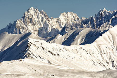 Mountain Covered With Snow Under Blue Sky thumbnail