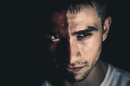 man with red face paint thumbnail