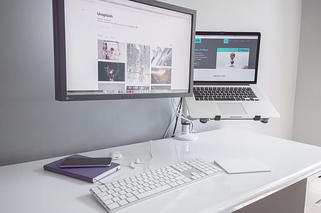 flat screen monitor, MacBook Pro, and Apple Magic Keyboard thumbnail