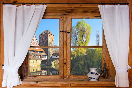 brown wood-framed with glass window pane with white window curtains thumbnail