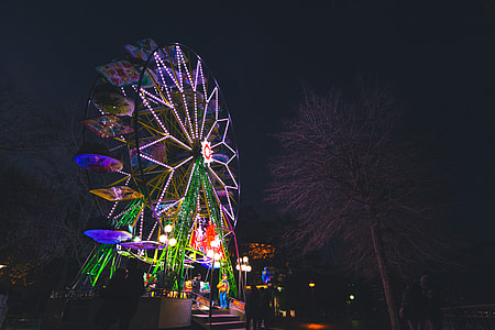 several people walking beside Ferris wheel thumbnail