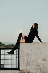 woman in black dress thumbnail