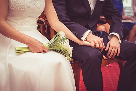 bride and groom sitting on chair thumbnail