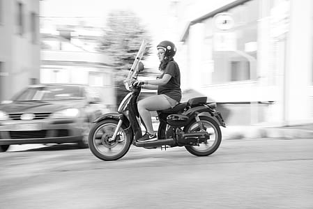 Woman Riding on Scooter Motorcycle thumbnail