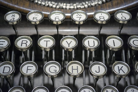 close-up photography of white typewriter keys thumbnail