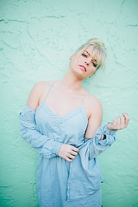 woman in blue spaghetti dress posing for photo thumbnail