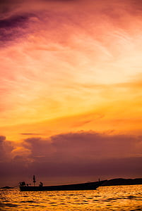 silhouette photography of body of water and sail ship thumbnail