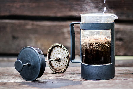 gray coffee press near wooden wall thumbnail