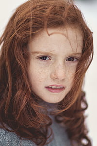 girl in gray knit top in close up photography thumbnail
