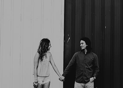 man and woman holding their hands thumbnail