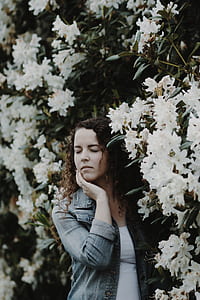 woman standing near flowers thumbnail