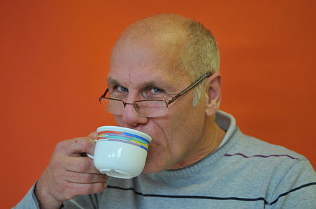 man holding ceramic mug thumbnail