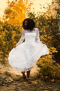 Woman Wearing Black Long-sleeved Dress thumbnail