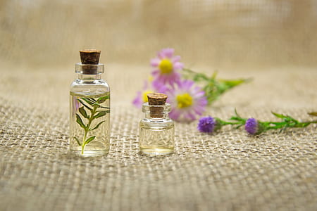 Two Clear Glass Bottles With Liquids thumbnail