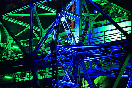 gray metal with green and blue reflect light building frame at night time thumbnail