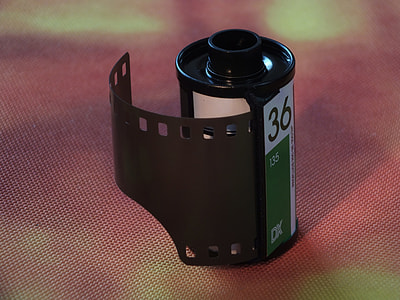 black and green graphic film on red textile thumbnail