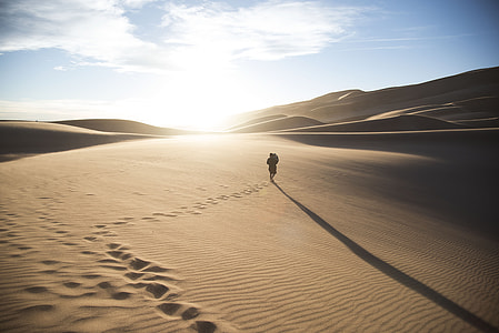 person walking on dessert thumbnail