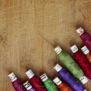 closeup photo of assorted-color threads thumbnail