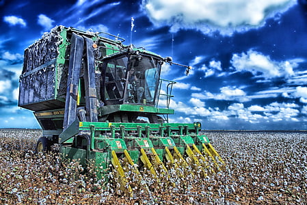 green heavy equipment on filed during daytime thumbnail