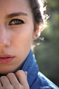 closeup photography of woman in blue top at daytime thumbnail
