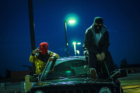 two men beside vehicle thumbnail