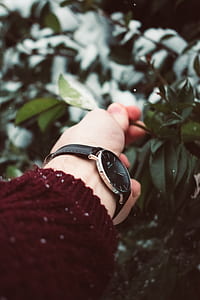 black analog watch with black leather strap thumbnail