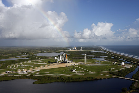 aerial view of green field with building during daytime thumbnail