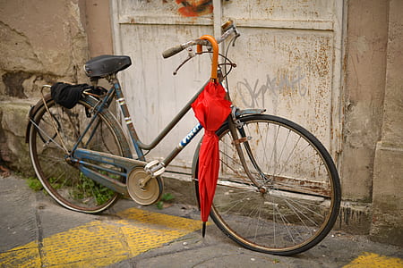 black and blue bike parked on sideways thumbnail