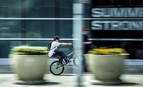 Man Riding Bicycle in City thumbnail