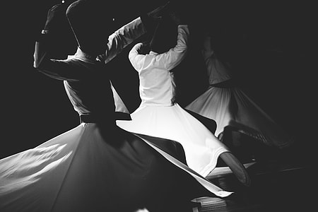 three person in white robe performing dance thumbnail