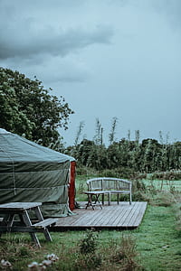 brown wooden folding table outside tent thumbnail