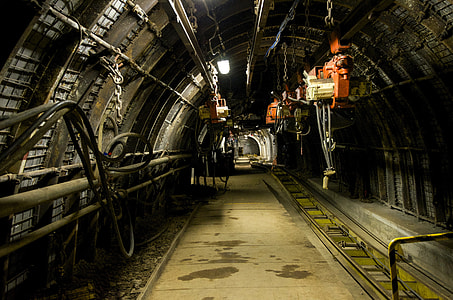photo of tunnel with orange electric hoist hanging on the ceiling thumbnail