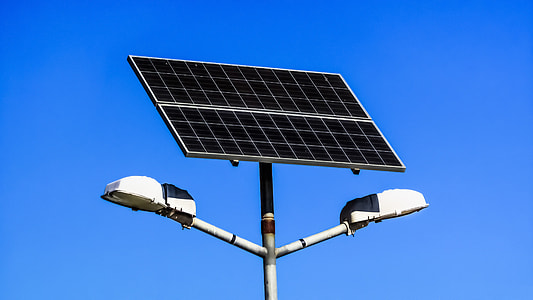 solar panel on post under clear blue sky thumbnail