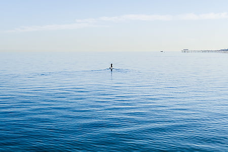 person in body of water during daytime thumbnail