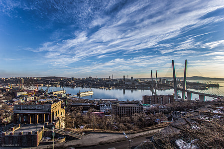 aerial photography of buildings near body of water thumbnail