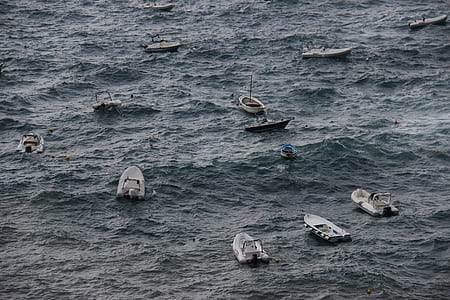 motor boats on calm sea at daytime thumbnail