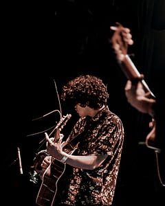 person playing guitar thumbnail