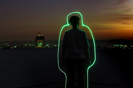 man standing on rooftop during sunset thumbnail