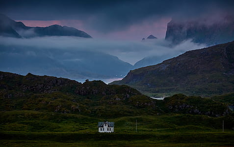 house in the middle on mountains thumbnail