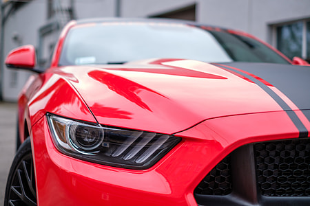 photography of red and black Ford Mustang thumbnail