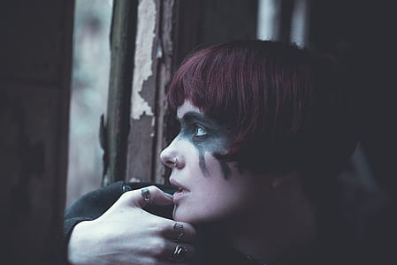 woman facing sideways placing her right hand on chin thumbnail