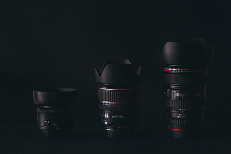 three black camera zoom lens with black background thumbnail