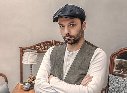 man sitting with crossed arms thumbnail