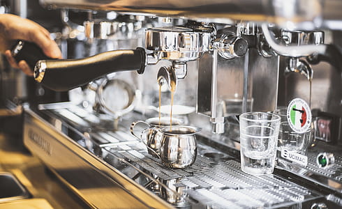 person using silver espresso maker thumbnail