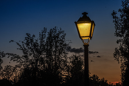 silhouette photography of lighted post lamp thumbnail