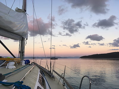 white boat sailing on body of water thumbnail