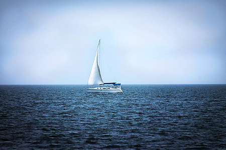 white sailboat on body of water during daytime thumbnail